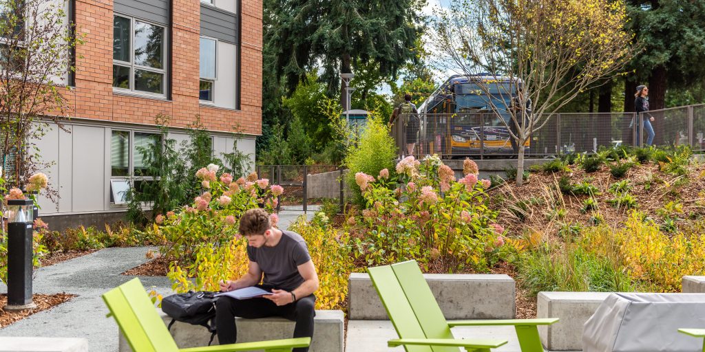 Shoreline Community College 7000 Campus green space with student working