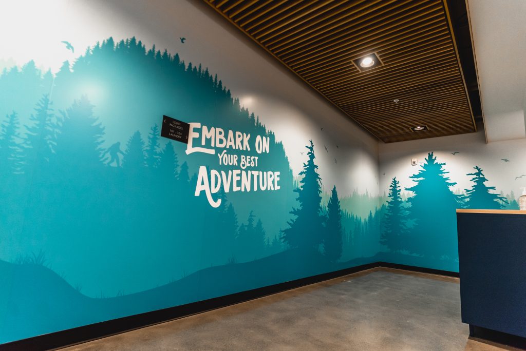 Wall mural that reads "Embark on your best adventure"