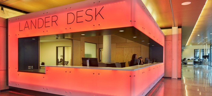 Lander Hall front desk lit in orange