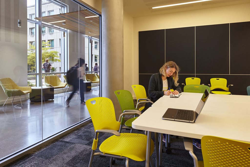 Person working in a conference room at Maple and Terry Hall