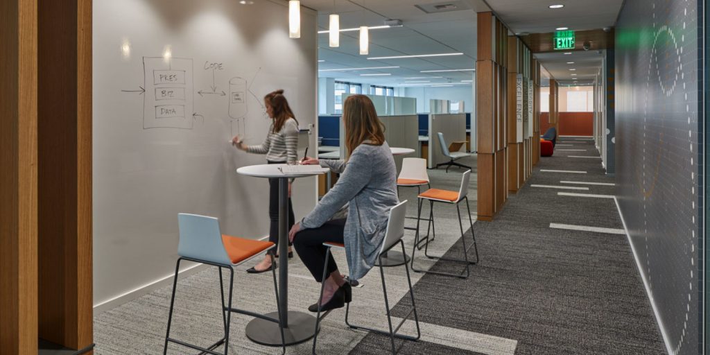 Seattle Children's 818 Stewart workspace with two people working